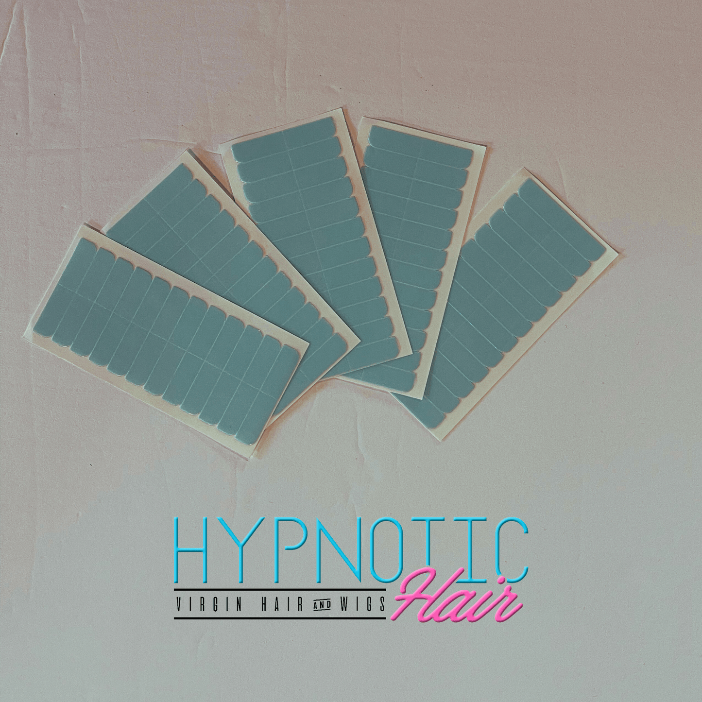 Easy Use Tape-In Adhesive strips for secure extensions, shown in five sheets with blue backing. Convenient and removable for tape-in hair systems.