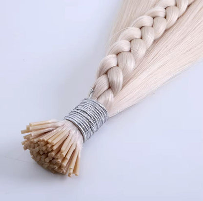 Braided platinum blonde I-Tip Remy Human Hair Extensions with silver wrap, highlighting reusable and safe styling quality.