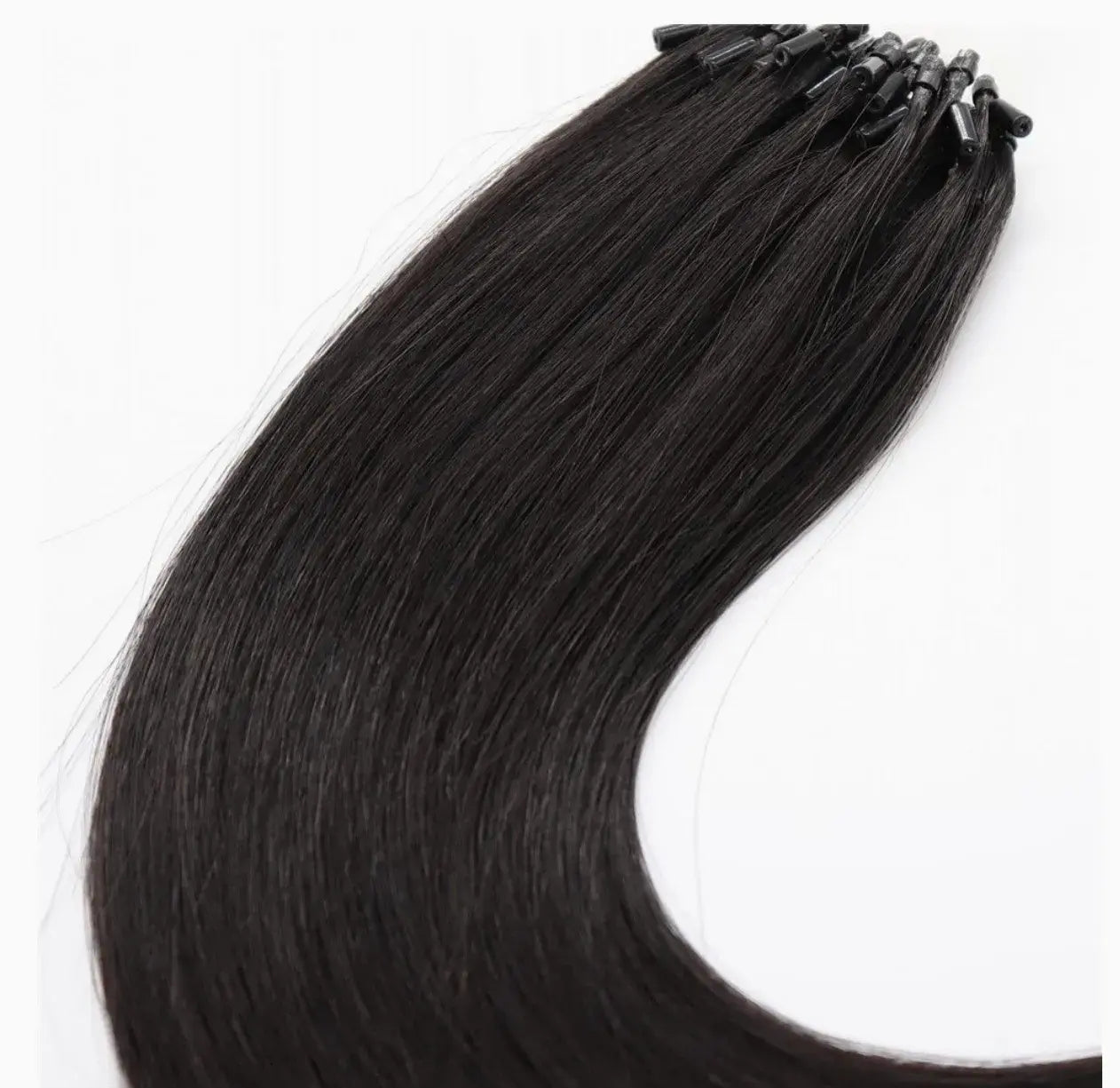 Seamless micro-link extensions in natural black shade from Hypnotic Virgin, offering a smooth, glue-free blend for natural hair enhancement.