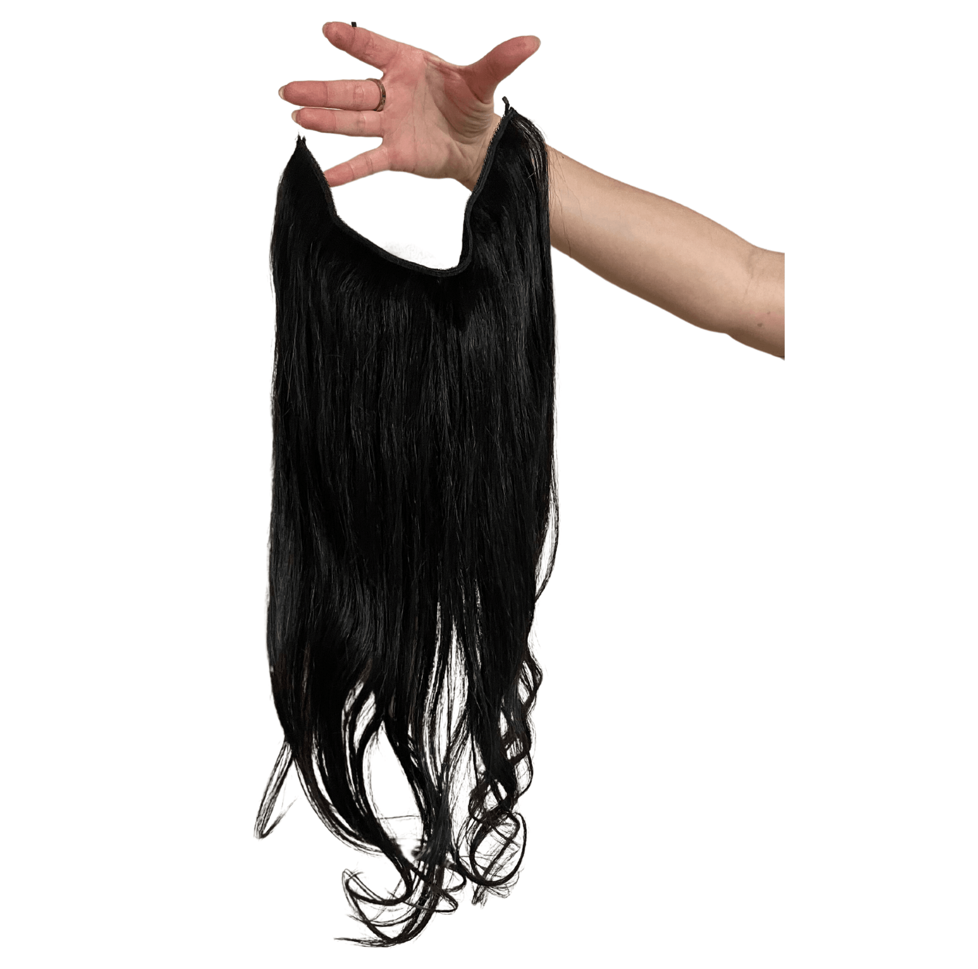 Model wearing long Halo Hair Extensions in natural black color